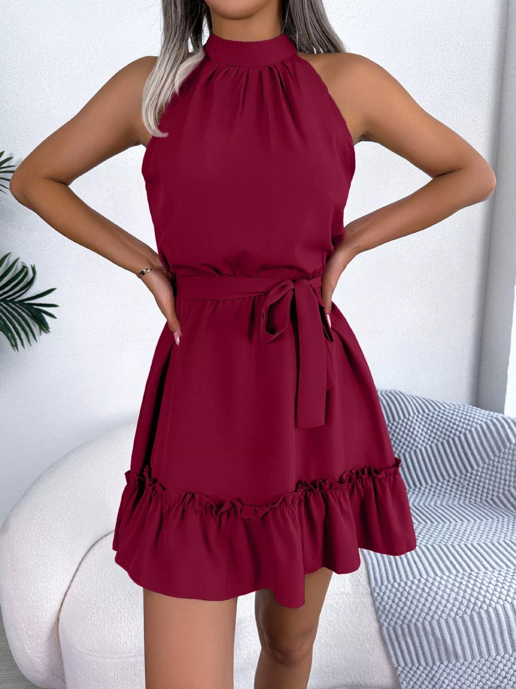 Halter Neck Ruffle Hem A-Line Dress in burgundy with belted waist.