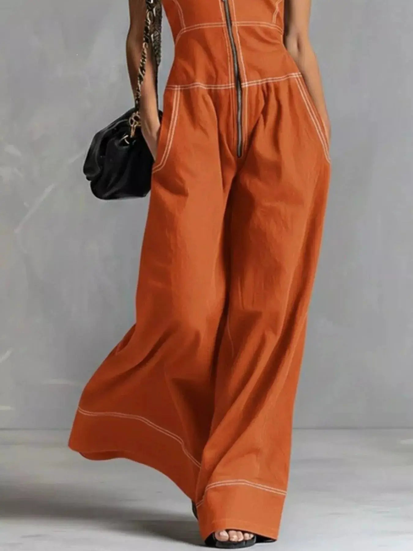 Zip-front sleeveless wide-leg jumpsuit by Trendsi in burnt orange with white topstitching