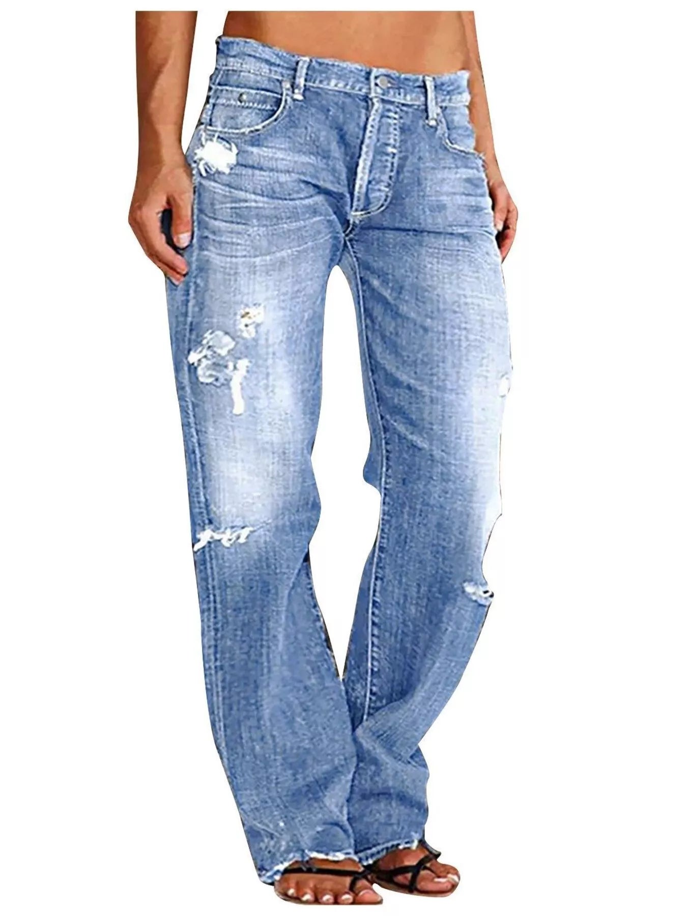 Distressed loose-fit jeans by Belle Bijouix, light blue denim with ripped knees.
