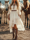 Lace Trimmed High-Low Dress in white with long lace sleeves and a brown belt