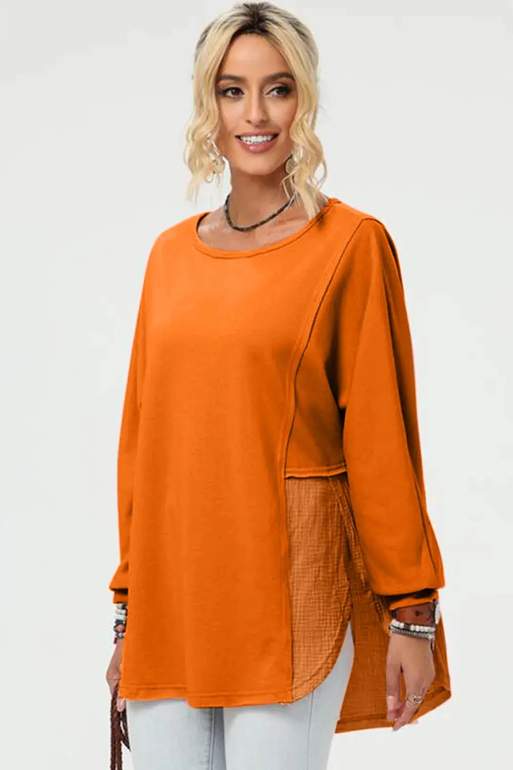 Belle Bijouix Double Take full-size long-sleeve high-low T-shirt in orange with side slit.