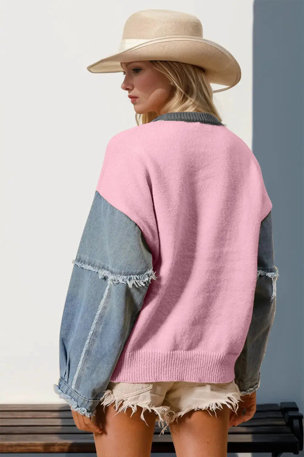 Sweater: pink knit with denim raglan sleeves, grey collar, frayed hem.
