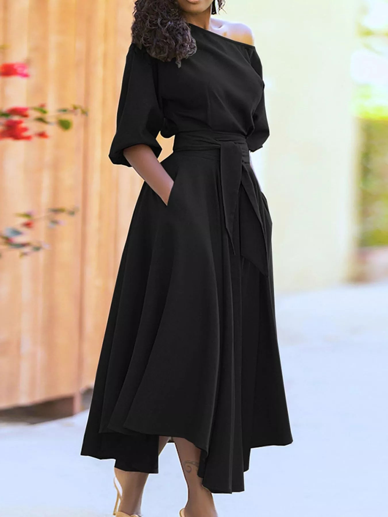 Boat Neck Tie Waist Dress in black with waist belt and flowing A-line skirt.