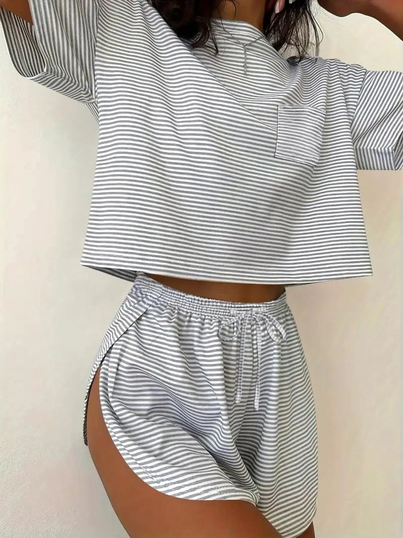 Printed round-neck tee and shorts set in gray and white stripes; cropped top with front pocket and drawstring shorts