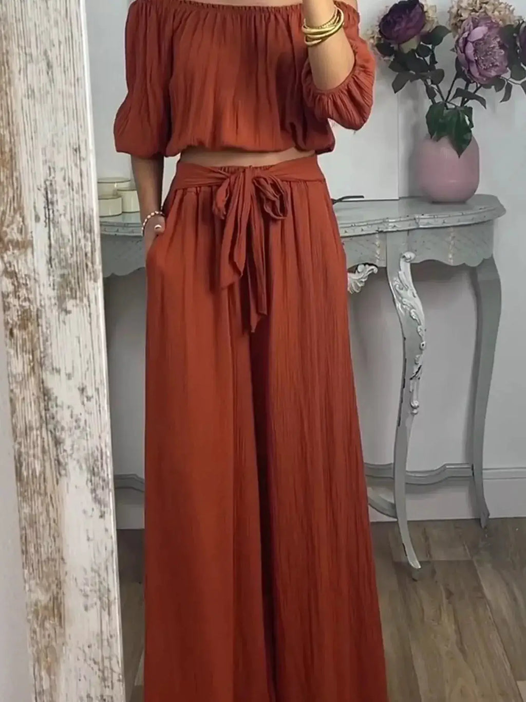 Full Size Off-Shoulder Top and Pants Set by Belle Bijouix in rust orange; tied waist, wide-leg pants, loungewear