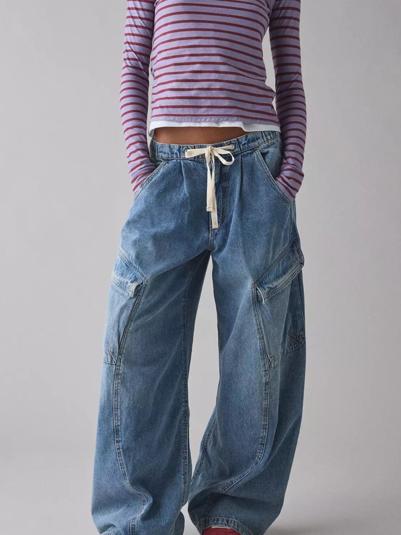 Drawstring Waist Cargo Jeans by Trendsi in blue denim with cargo pockets.