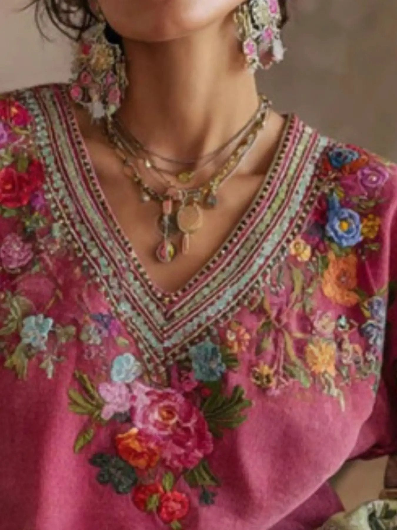 Plus-size pink floral embroidered v-neck blouse with beaded neckline