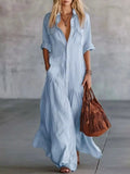 Plus Size Maxi Dress by Belle Bijouix in light blue with button front, pockets, and roll-up sleeves