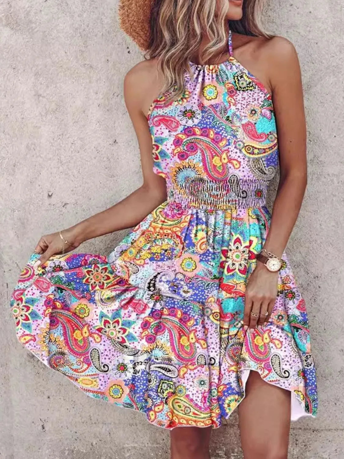 Paisley Print Halter-Neck Mini Dress featuring smocked waist and ruffled hem, colorful