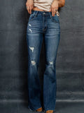 Distressed High-Waisted Flare Jeans in blue denim with pocket detailing