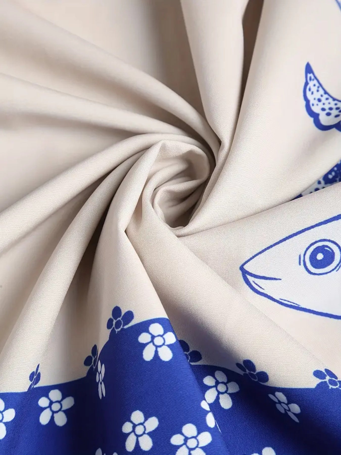 Sardine Print Spaghetti Strap Midi Dress; beige fabric with blue floral print pattern