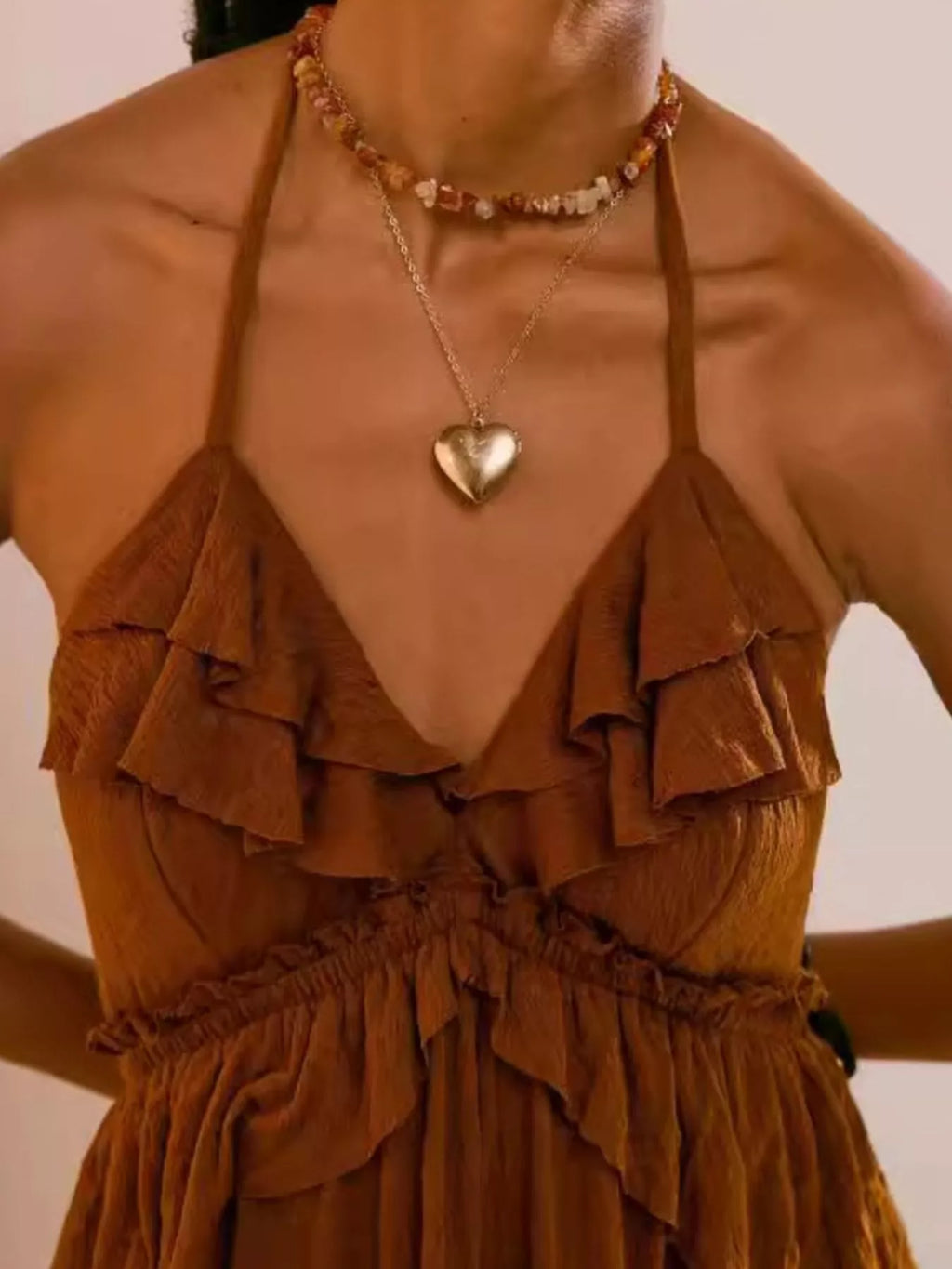 Ruffled halter-neck maxi dress in warm brown by Belle Bijouix.