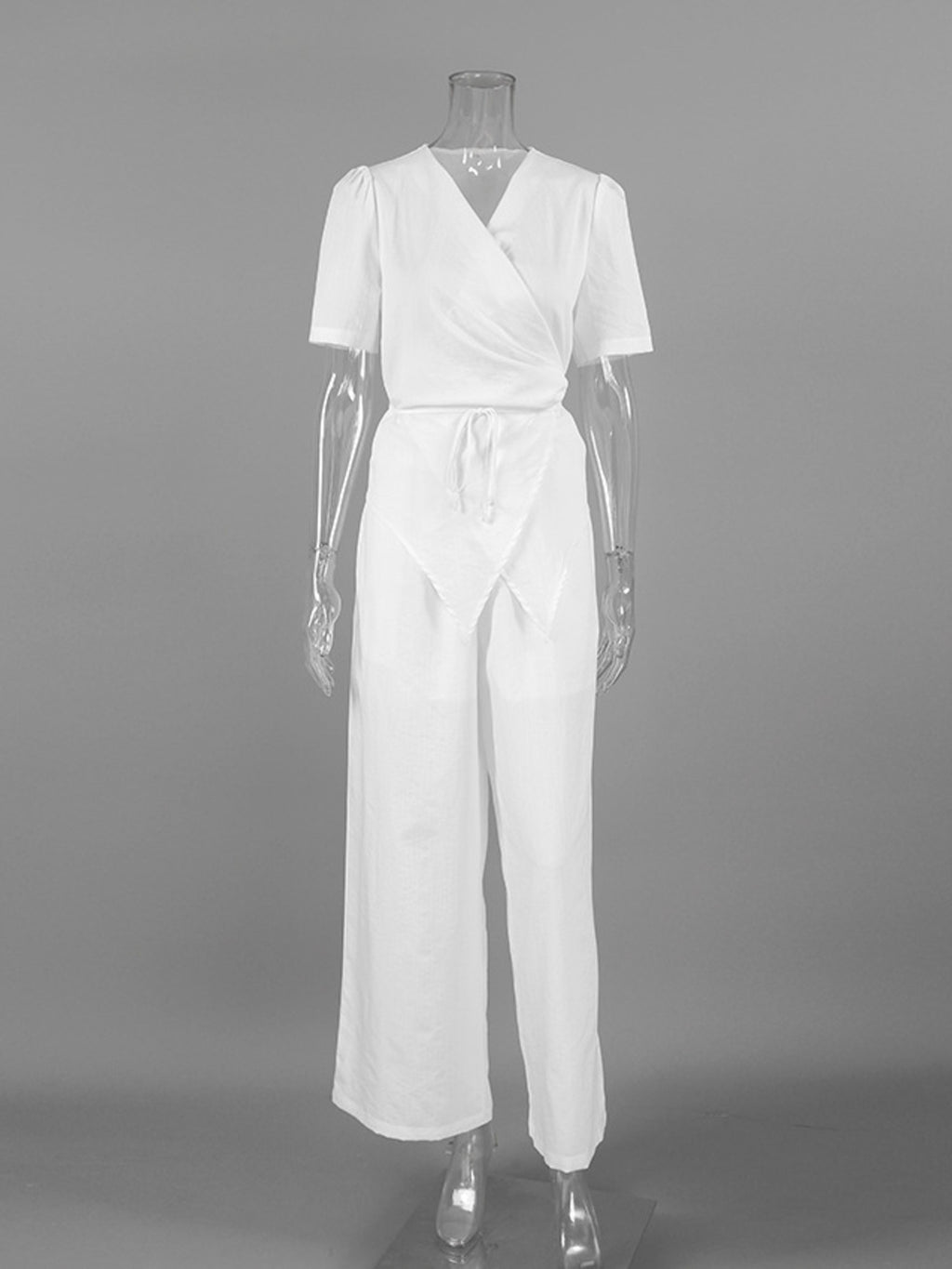 Wrap Top & Wide Leg Pants Set by Belle Bijouix in white on a mannequin