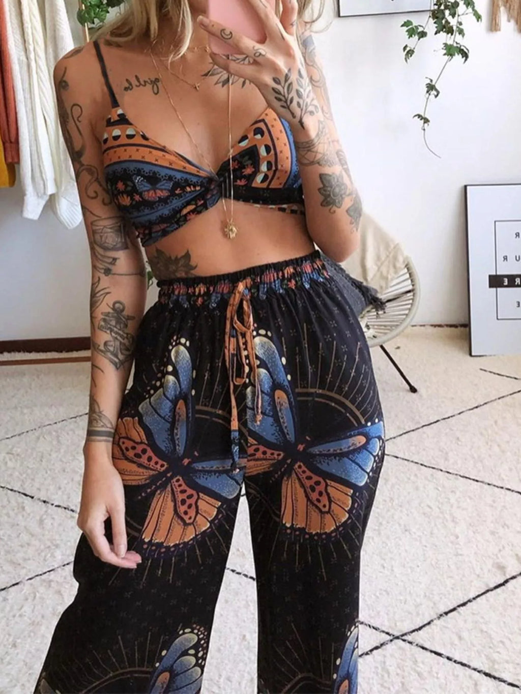 Boho butterfly print top and pants set by Trendsi, orange and blue butterfly motifs on black fabric