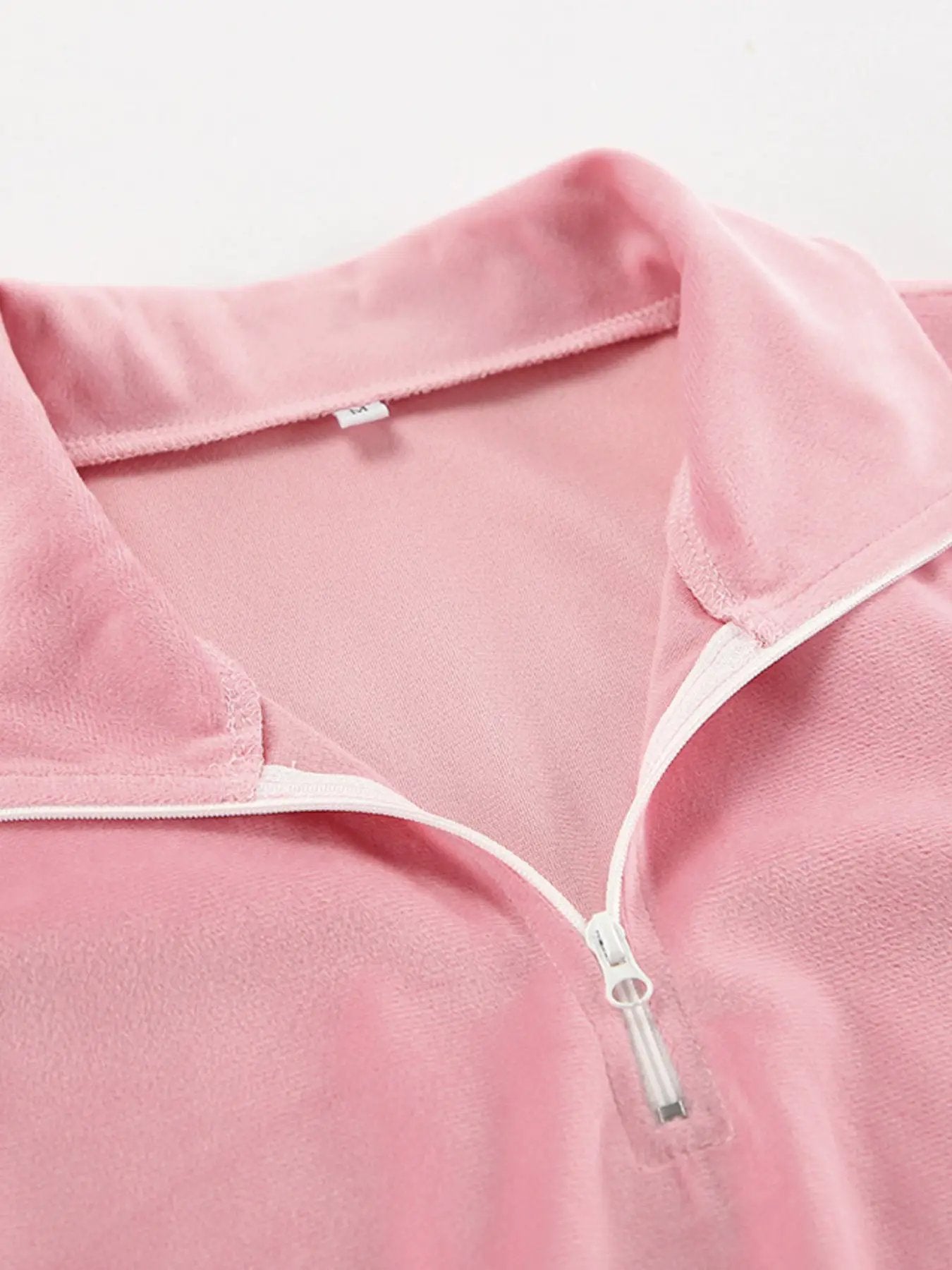 Quarter Zip Long Sleeve Top in pink fleece with white zipper