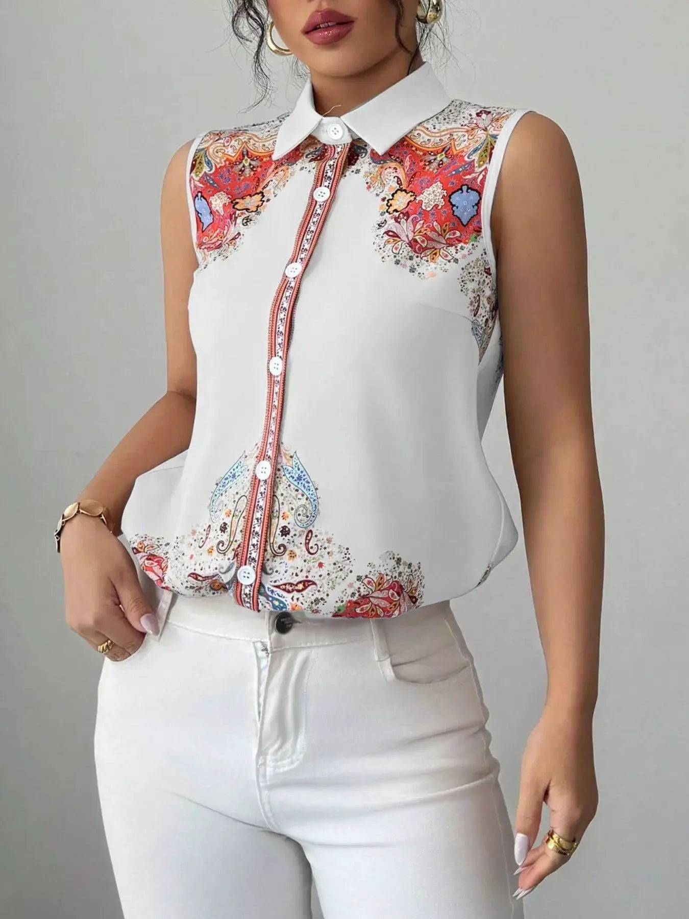 Button Up Sleeveless Shirt with white collar and colorful paisley print along front placket.
