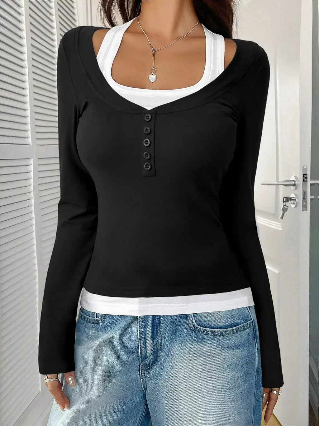 Scoop Neck Long Sleeve T-Shirt in black with white underlayer and front button placket
