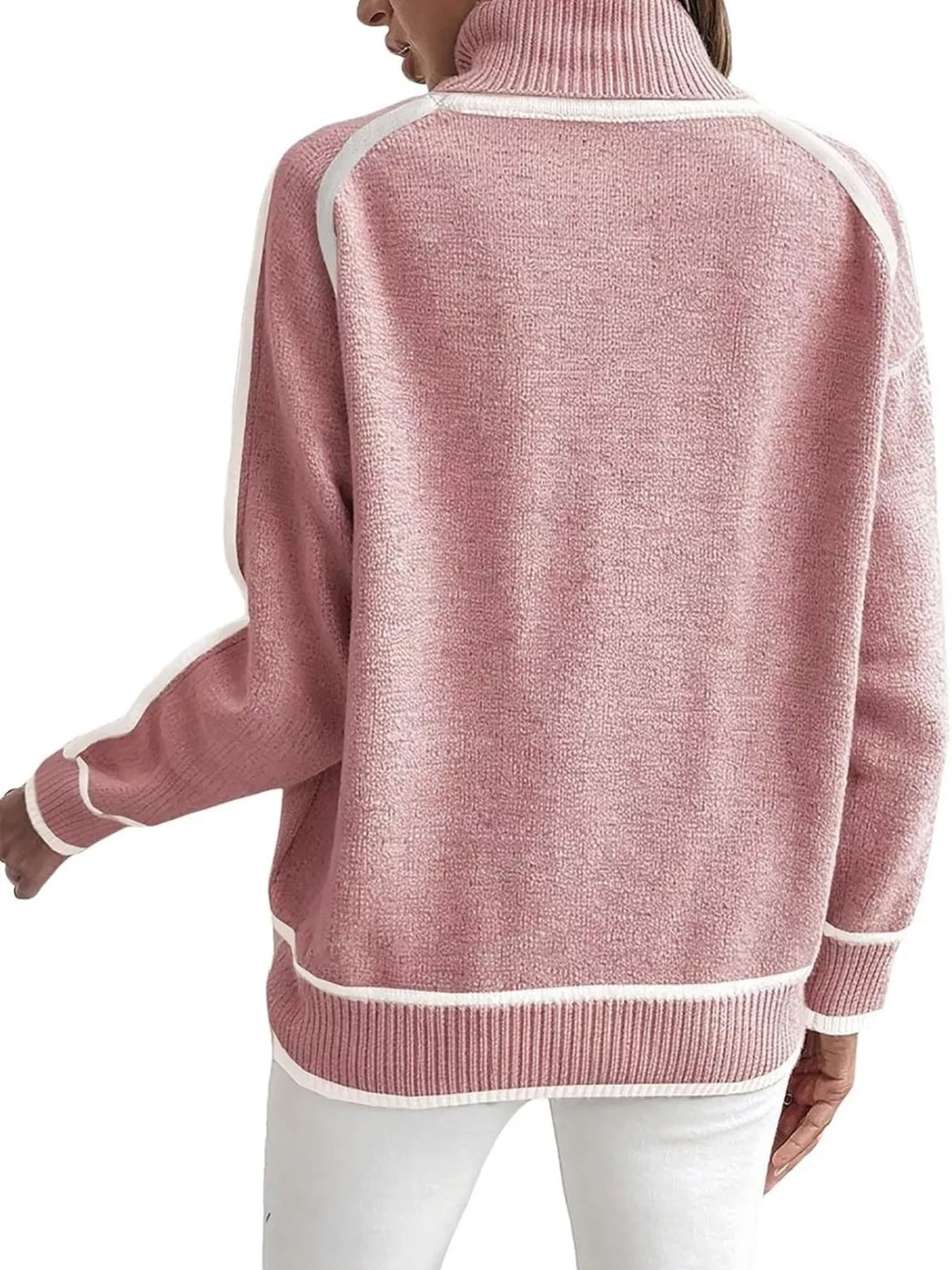 Back view of pink turtleneck sweater with white contrast trim and ribbed hem