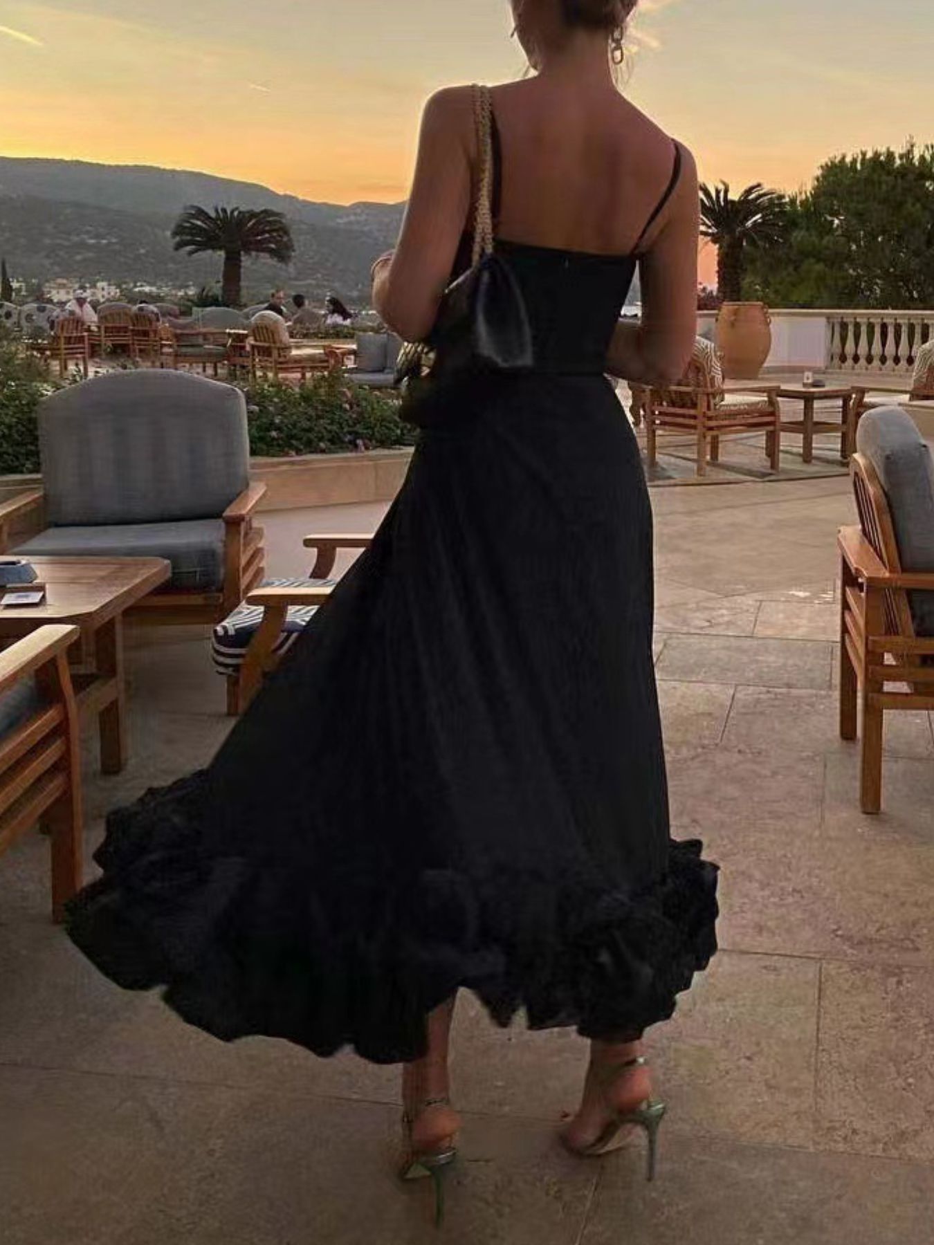 Ruffle Hem Scoop Neck Midi Dress by Trendsi, black, back view on model at sunset resort