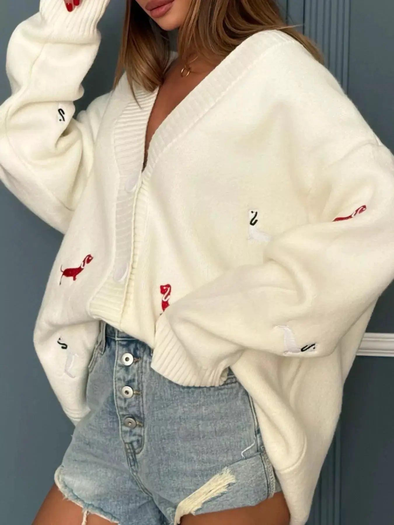 Embroidered Button-Up Cardigan, white knit by Belle Bijouix, with red dog embroidery and button-front.