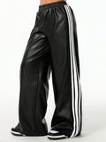 Striped wide-leg pants in black faux leather with white side stripes, by Trendsi