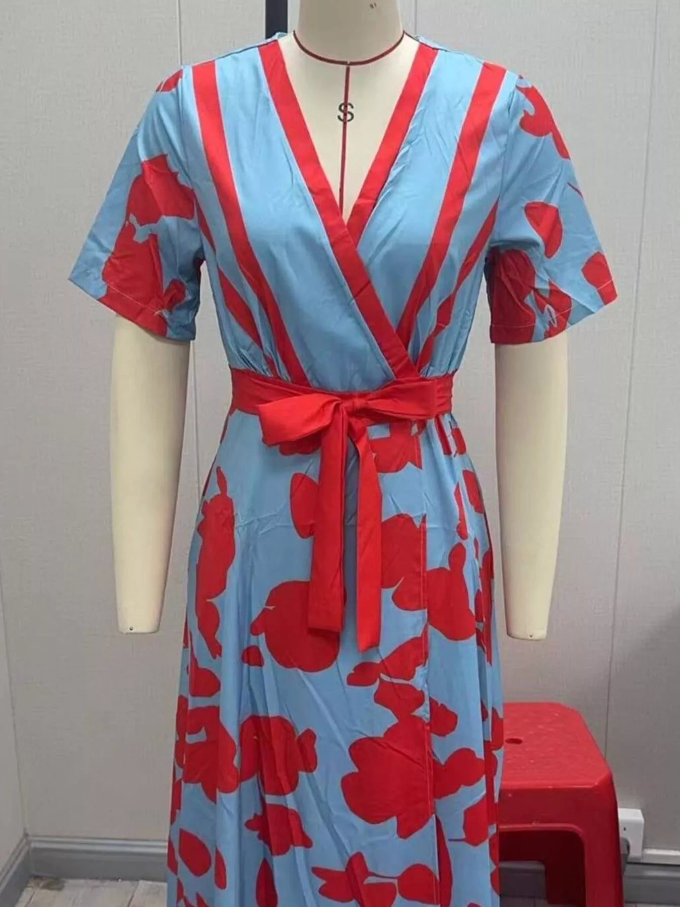 Floral print half-sleeve maxi dress in blue with red flowers, wrap-front with red belt