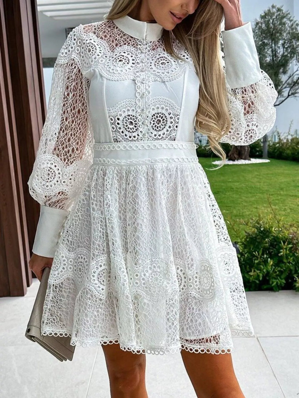 Lace Lantern Sleeve Mini Dress in white with buttoned bodice and floral lace detailing.