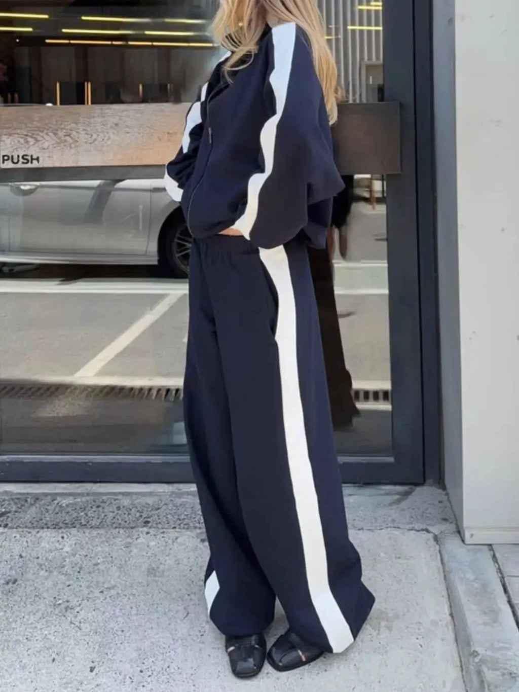 Two-Piece navy zip-up long-sleeve outerwear and pants set with white side stripes