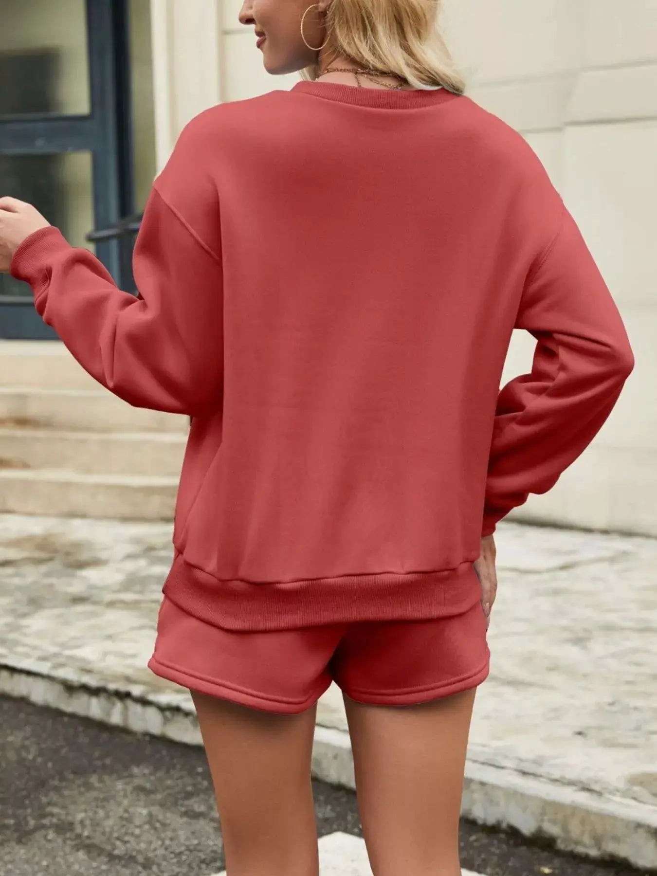 Round neck dropped-shoulder top and drawstring shorts 2-piece lounge set in coral by Belle Bijouix