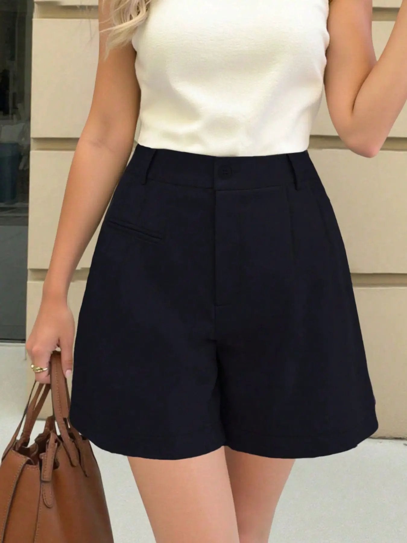 High-Waisted Shorts in navy with front pocket detailing for a tailored look.