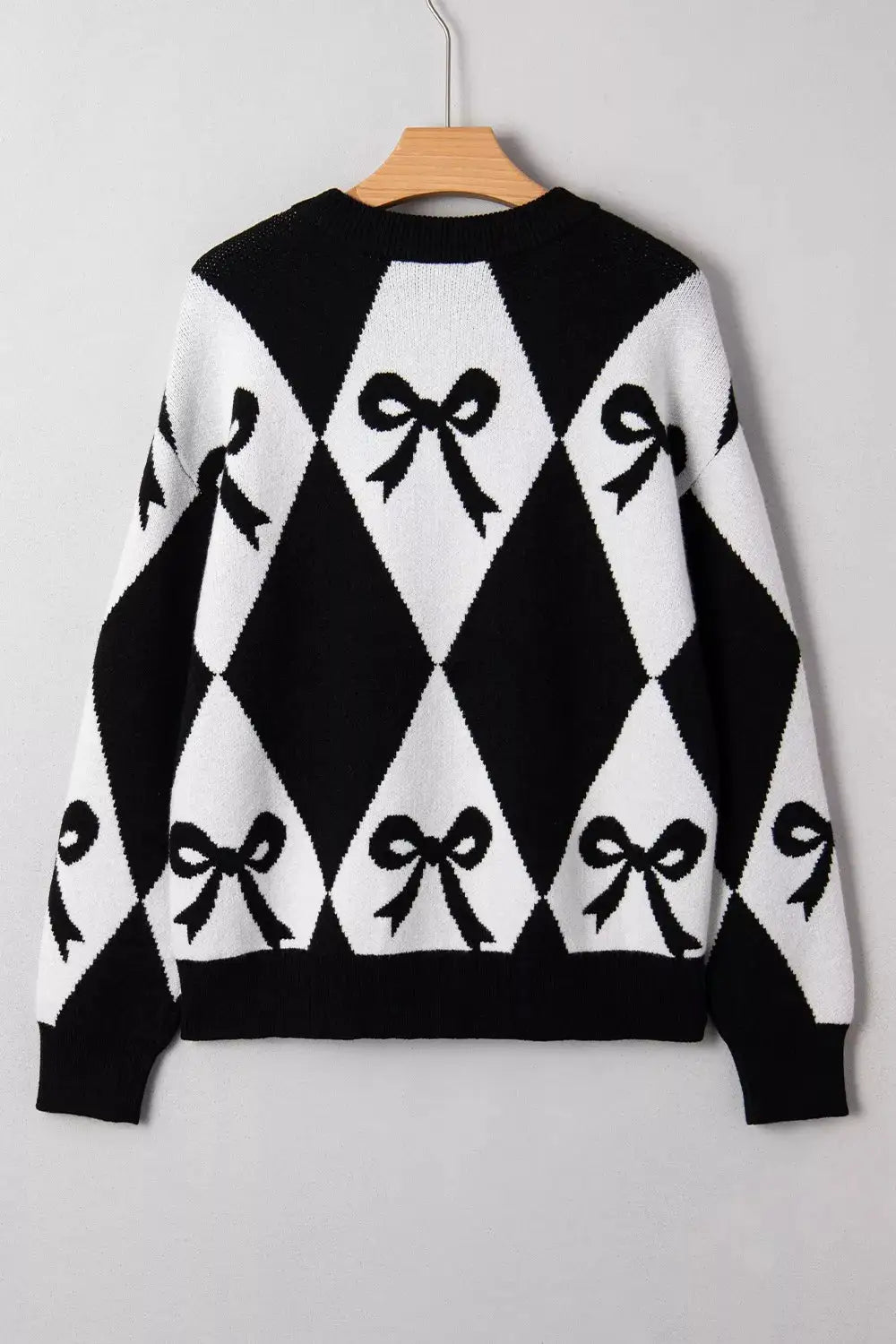 Bow Pattern Long Sleeve Contrast Sweater by Belle Bijouix in black and white argyle with bow motifs