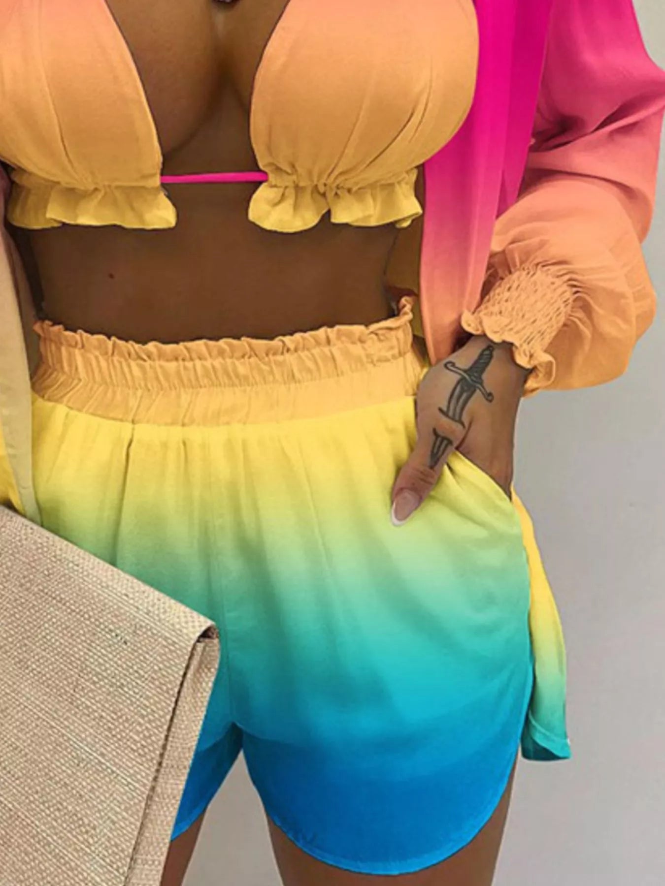 3-piece plus-size outfit set: halter-neck yellow cami, sheer pink shirt, and rainbow gradient shorts
