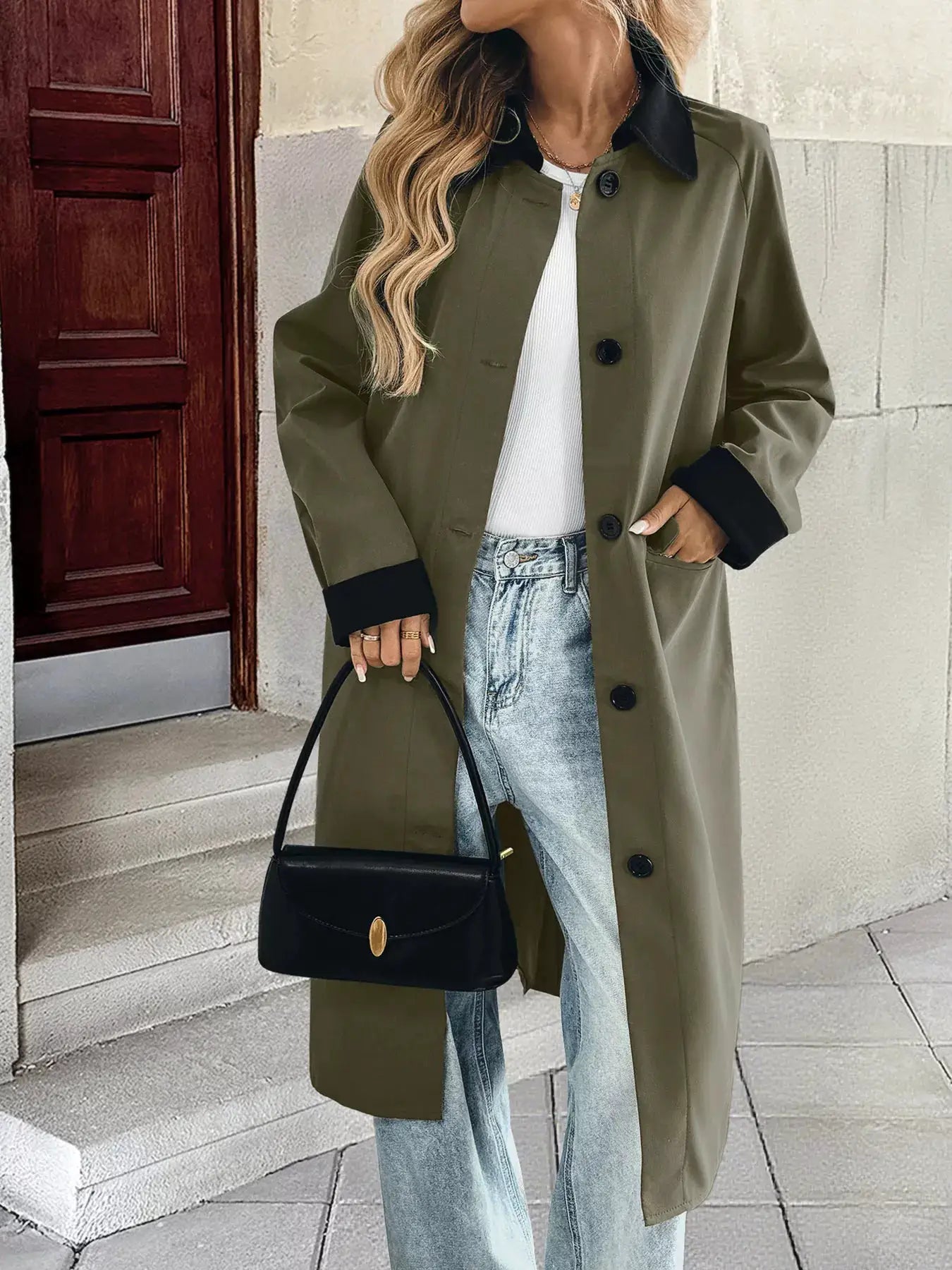 Contrast Collar Button Up Coat in olive with black cuffs and collar, buttoned front and pockets, with a black handbag