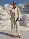Beige button-up long-sleeve shirt and pants set worn with white crop top