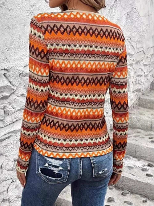 Bohemian Geometric Pattern Long Sleeve T-Shirt in orange, brown, and cream; back view on model