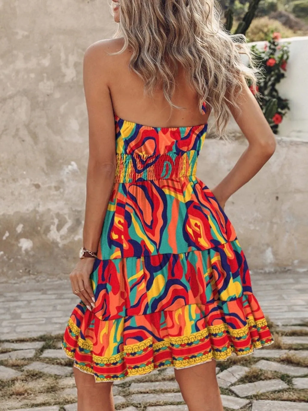 Paisley Print Halter Neck Mini Dress in rainbow colors with smocked waist and layered ruffles.