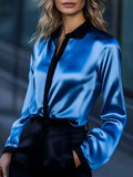 Button Up Long Sleeve Shirt in blue satin with black collar and placket.