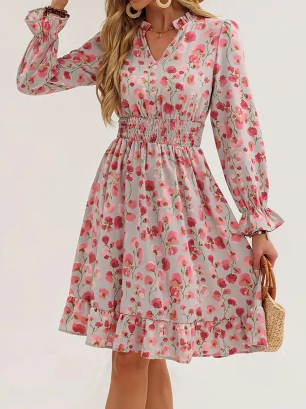 Dress by Belle Bijouix: pink floral print with smocked waist, flounce sleeves, and ruffled hem.