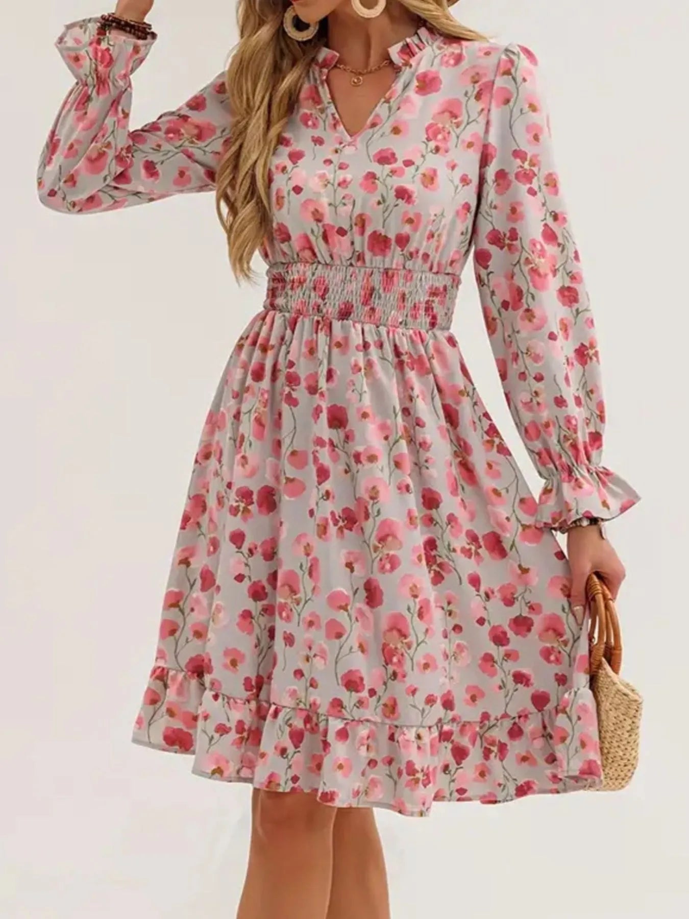 Dress by Belle Bijouix: pink floral print with smocked waist, flounce sleeves, and ruffled hem.