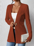 Single-Button Long Sleeve Blazer in rust color, open-front over white top; white clutch with gold chain.