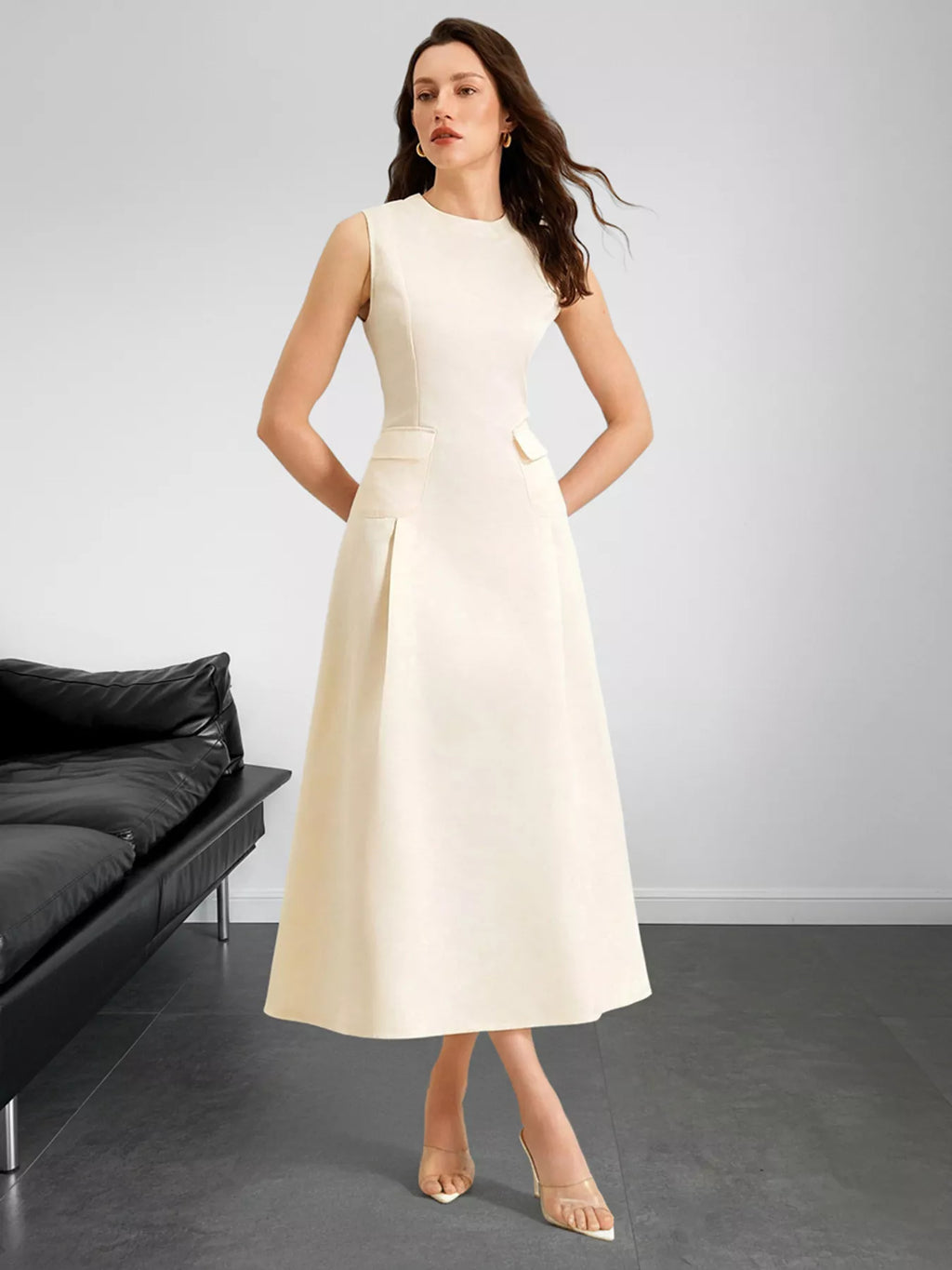 Sleeveless A-line midi dress with pockets in ivory by Belle Bijouix