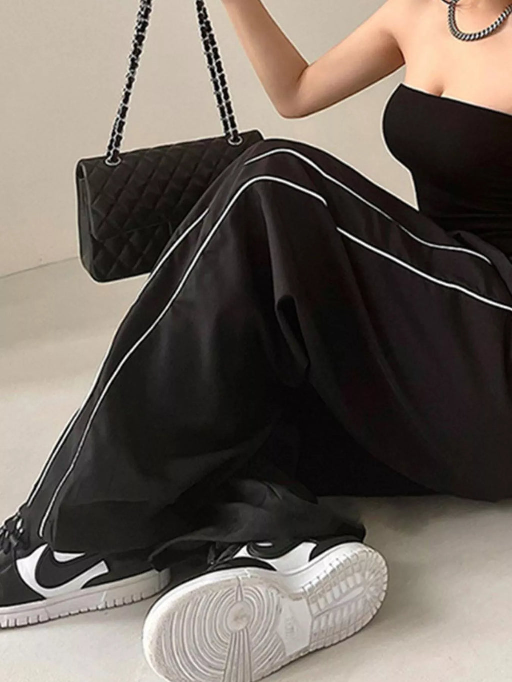 Elastic Waist Wide Leg Pants by Trendsi in black with white piping.