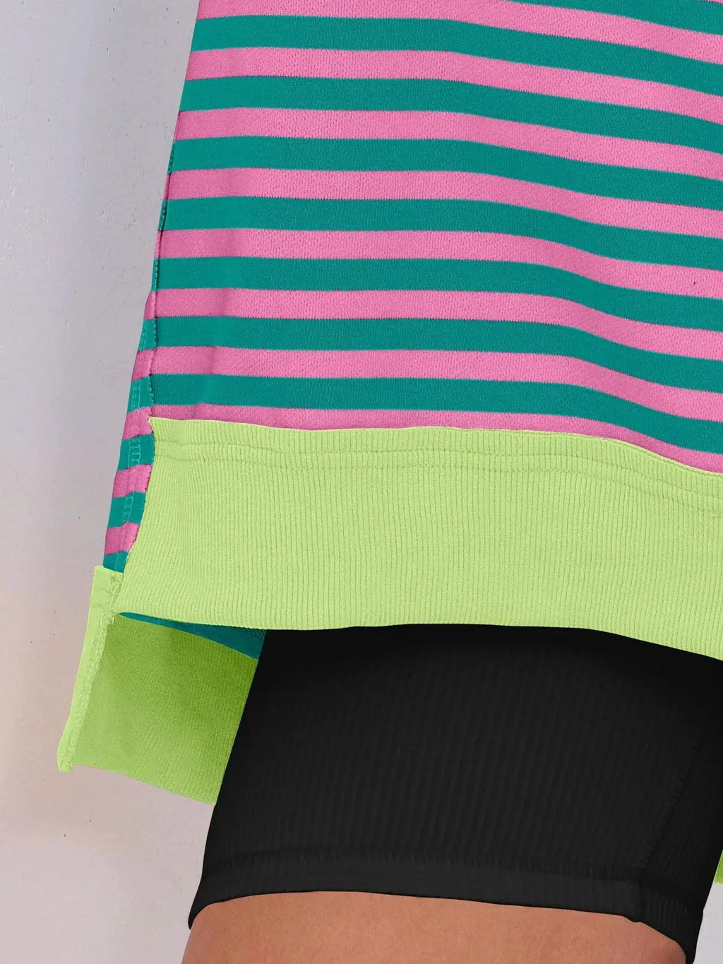 Notched Long Sleeve Oversized Sweatshirt; pink and teal striped top with neon lime ribbed hem