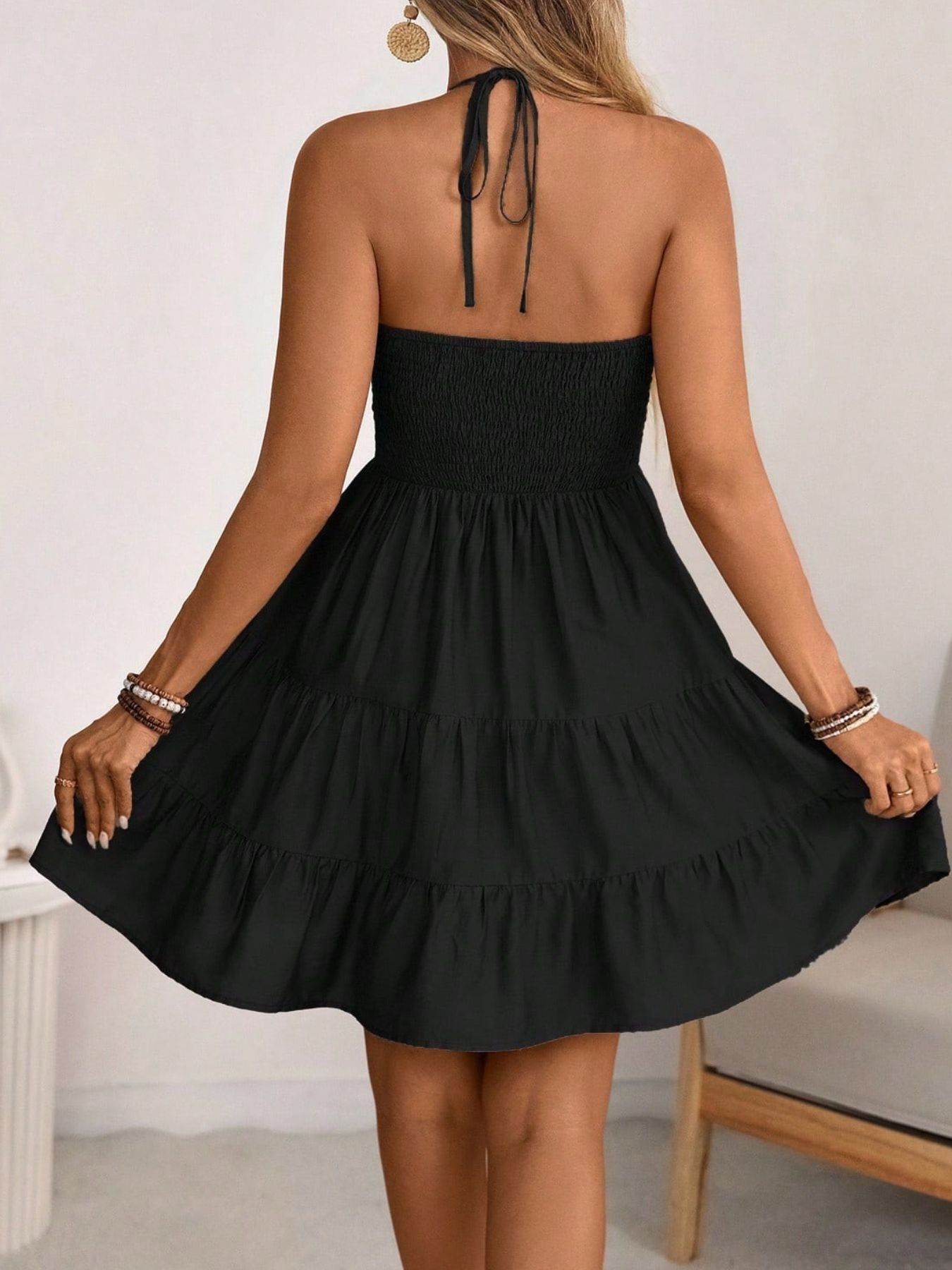 DRESS Bellebijouix black smocked halter-neck tiered dress with a ruffled skirt