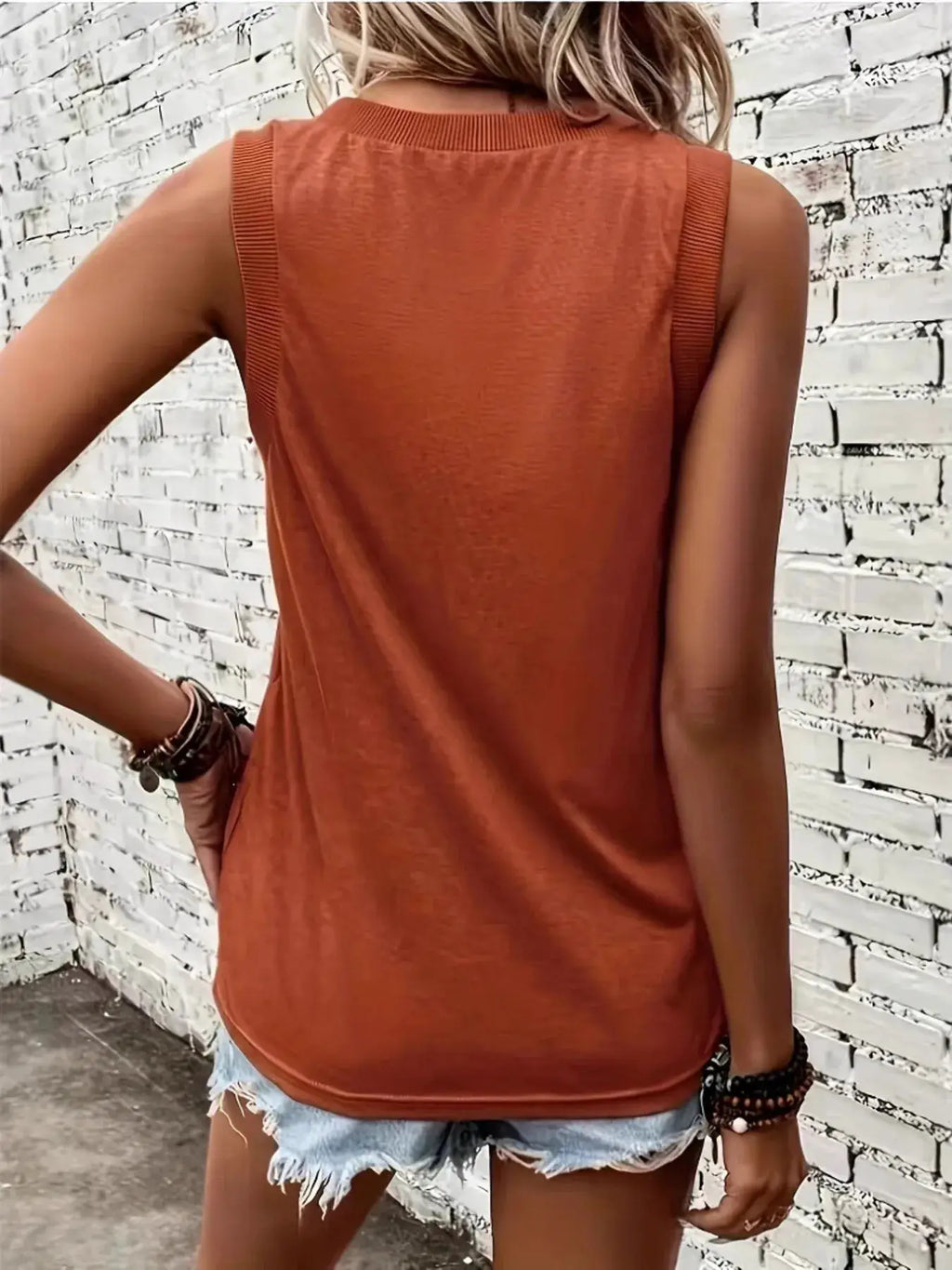 V-Neck Tank top in rust color with wide ribbed shoulder straps; back view with frayed denim shorts