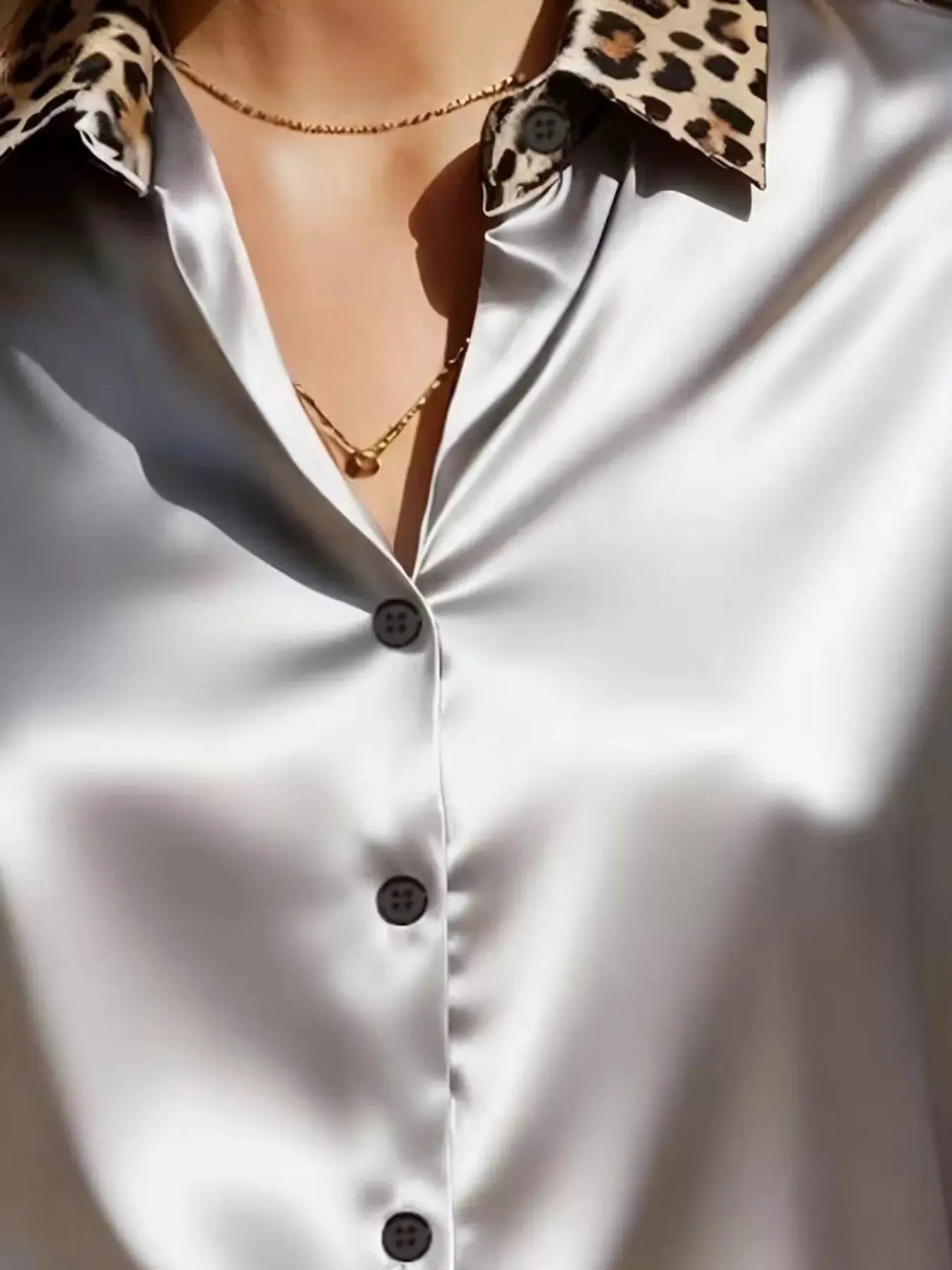Leopard Button Up Long Sleeve Shirt with leopard-print collar on white satin fabric.