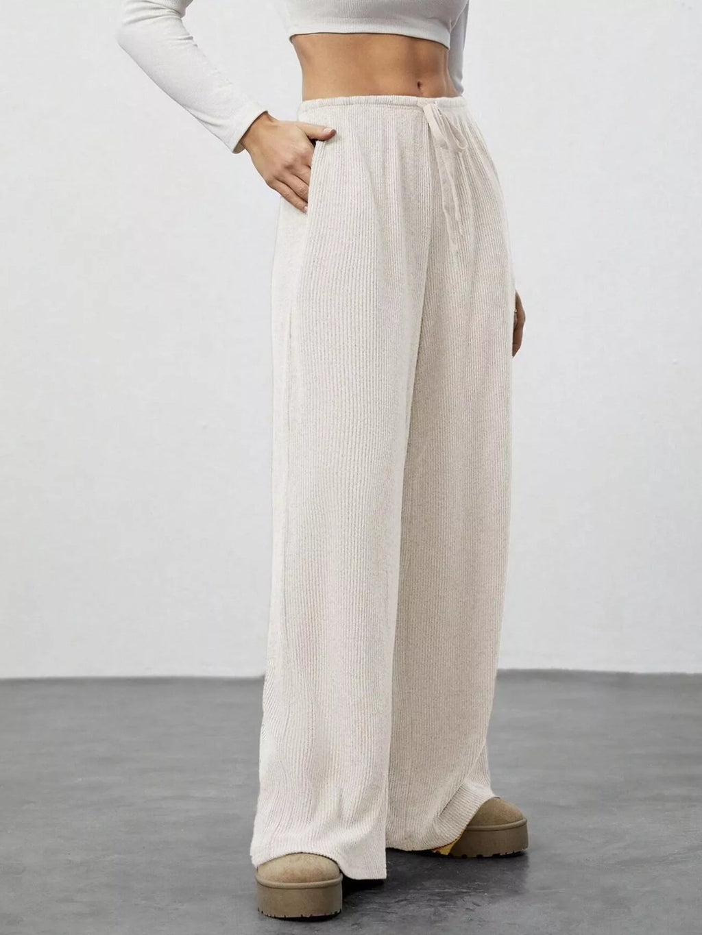 Relaxed Fit Drawstring Pants by Belle Bijouix in beige knit with pockets