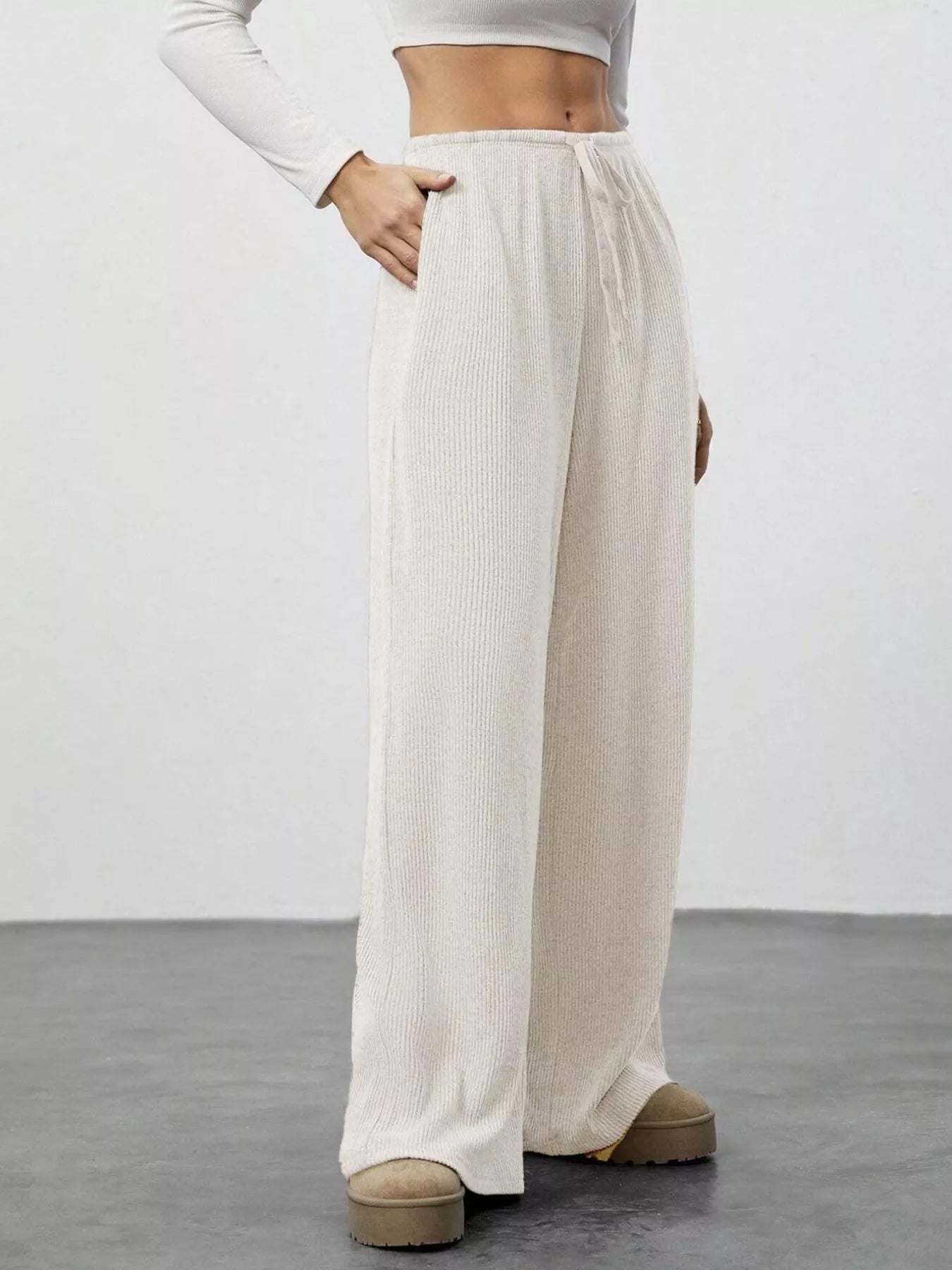 Relaxed Fit Drawstring Pants by Belle Bijouix in beige knit with pockets