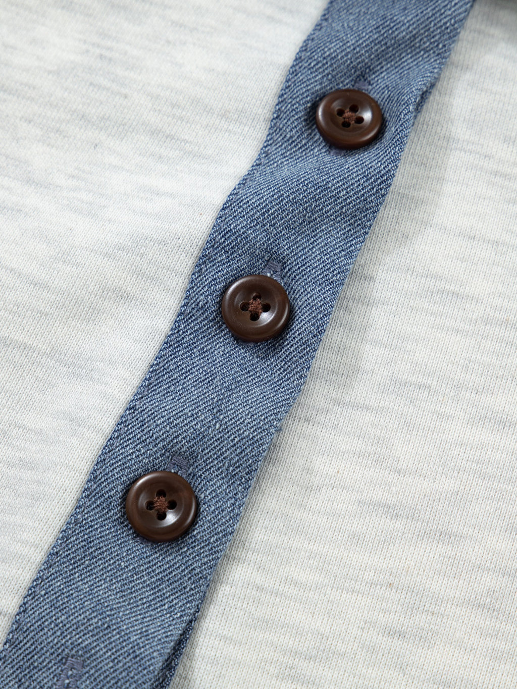 Contrast Trim Button Detail Top featuring blue denim trim and brown buttons on light gray fabric