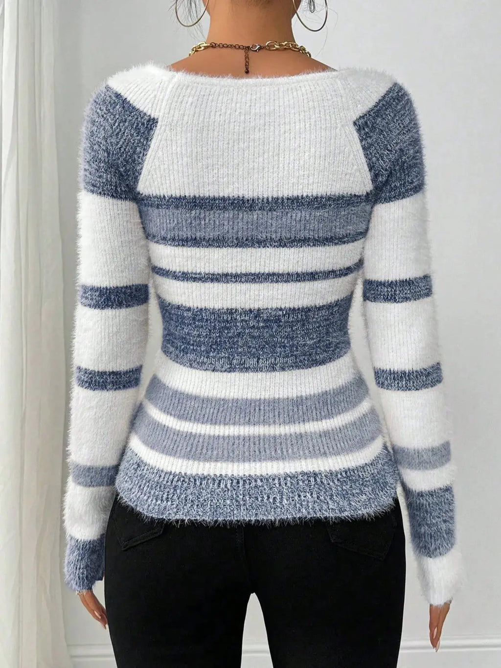 Striped fuzzy long-sleeve sweater; white and blue-gray knit, back view